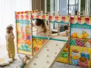 Large Montessori playground with wooden and rope ladder